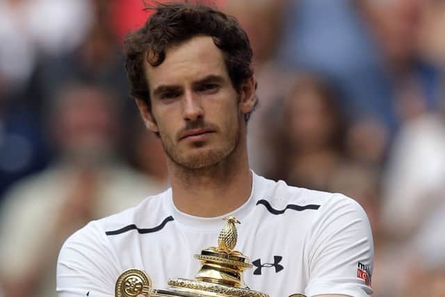 Tennis legend Andy Murray with the Wimbledon trophy.