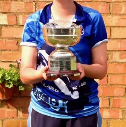 Hannah winning a county trophy