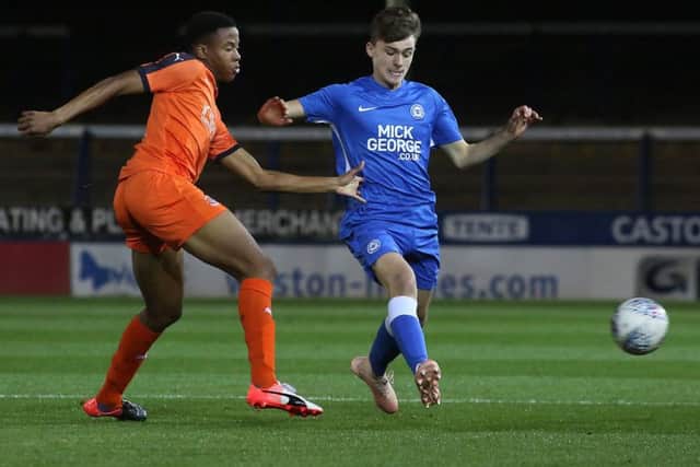 Harrison Burrows (right) in action for Posh youths,