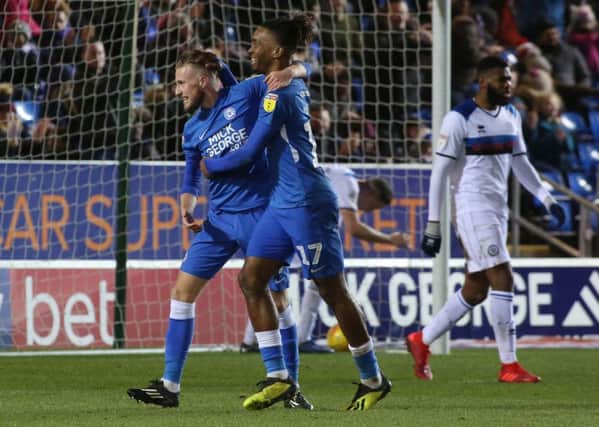 George Cooper (left) celebrates his goal for Posh against Rochdale with teammate Ivan Toney.