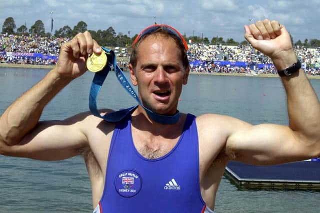 Steve Redgrave with his gold medal from the Sydney Olympics.