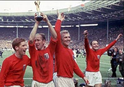 Bobby Charlton (second left) with the World Cup.