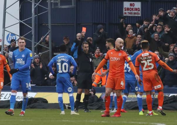 Ryan Tafazolli of Peterborough United is shown a straight red card. Picture: Joe Dent