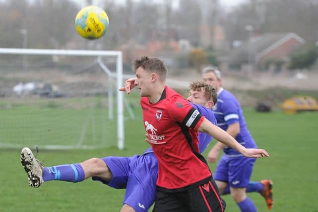 Action from Stilton United's 3-1 win at NECI (purple). Photo: David Lowndes.