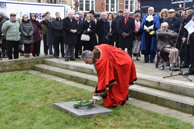 Wreaths are laid at the Holocaust Memorial in teh city centre