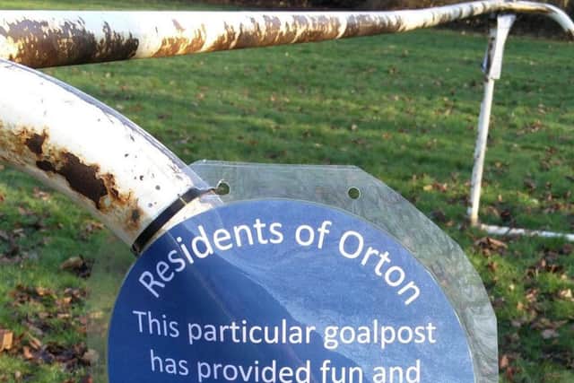 A sign left on the goal post. Photo: Julie Howell