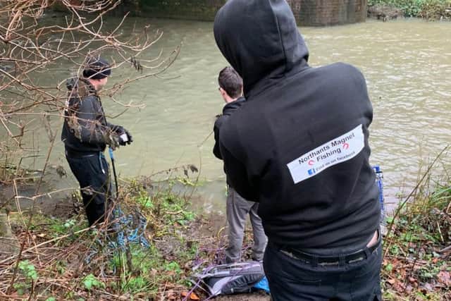 Nigel Lamford, 47, has recovered more than 20 guns and grenades - as well as wartime bullets - from a ten mile stretch of the River Nene. Photo: SWNS