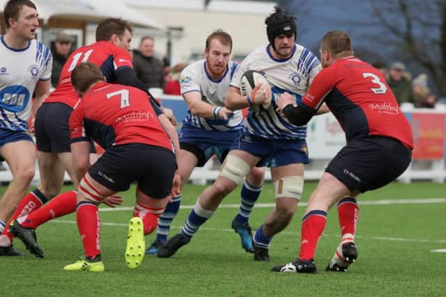 Lions skipper Conor Gracey on the charge against Chester.