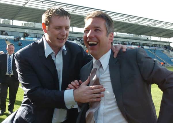 Posh chairman Darragh MacAnthony (left) and manager Darren Ferguson celebrate promotion from League One in April, 2009.