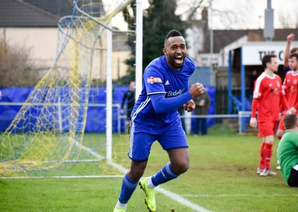 Avelino Vieira wheels away in delight after opening the scoring for Peterborough Sports against Coleshill. Photo: James Richardson.