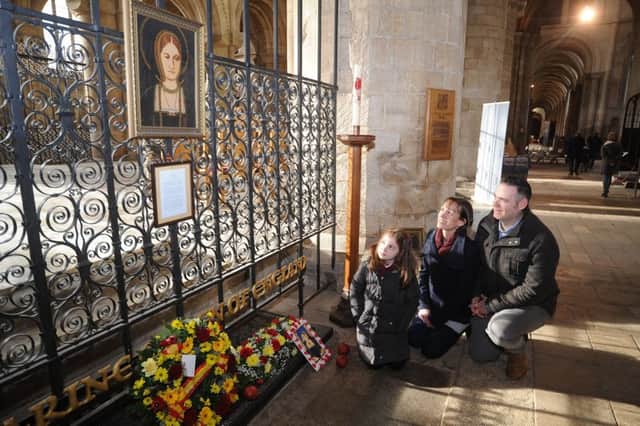 Katharine of Aragon weekend at Peterborough Cathedral.  At the Queen's grave Robert, Becky and Isobel (9) Sansom. EMN-190126-161421009