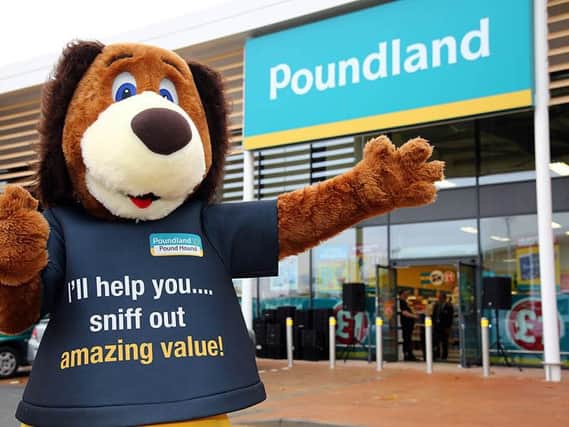 Poundland's mascot Poundhound outside a typical Poundland store.