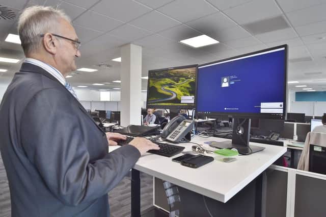 Interiors of Sand Martin House at  Fletton Quays. Council leader Cllr John Holdich using a stand-up desk. EMN-180916-153018009