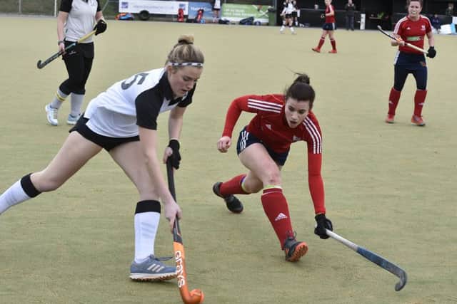 Action from City of Peterborough Ladies 1sts (red) v Harleston last weekend. Photo: David Lowndes.
