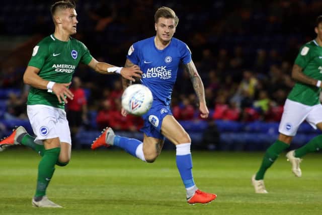 Jason Cummings (centre) has left Posh and joined Luton on loan.