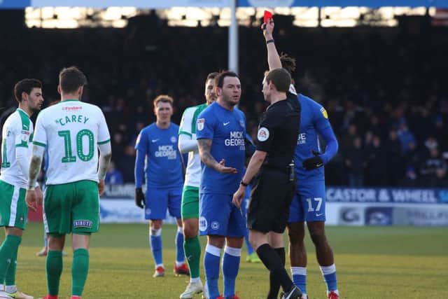 Posh playmaker Lee Tomlin is sent off against Plymouth by referee Peter Wright. Photo: Joe Dent/theposh.com.