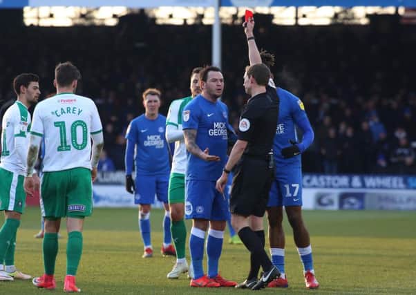 Posh playmaker Lee Tomlin is sent off against Plymouth by referee Peter Wright. Photo: Joe Dent/theposh.com.