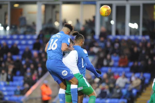 Posh centre-back Rhys Bennett attacks a cross against Plymouth. Photo: David Lowndes.