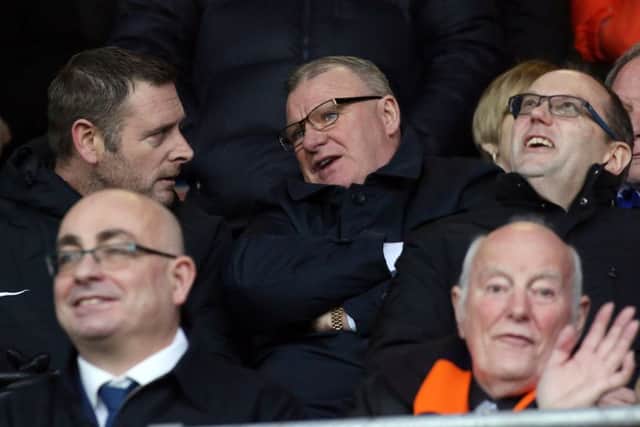 Posh chairman Darragh MacAnthony (left) with former manager Steve Evans.