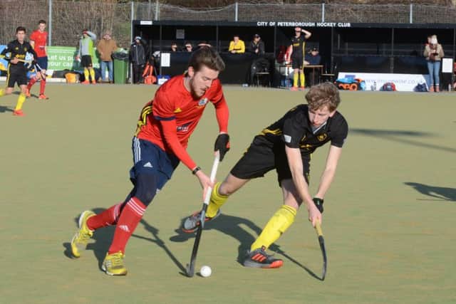 Adam Wilson (red) on the attack for City of Peterborough against Beeston. Photo: David Lowndes.