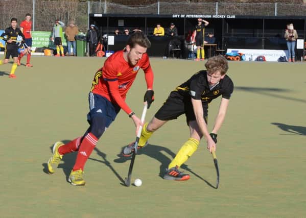 Adam Wilson (red) on the attack for City of Peterborough against Beeston. Photo: David Lowndes.