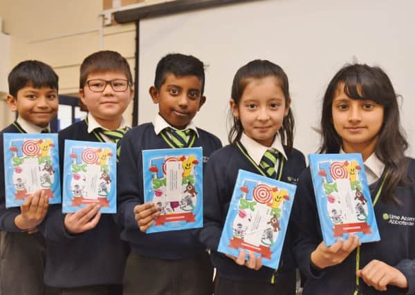 Lime Academy Abbotsmede pupils Vedant Bishwokarma, Sameer Akbari, Vatneesan Jeyanthiran, Mahsa Alizadeh and Inaayah Ali who have has their stories published  in a Young Writers short story book. EMN-190202-222821009