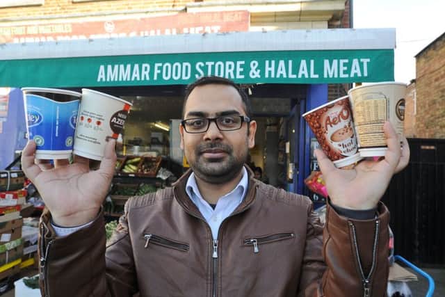 Bilal Nasir outside his shop
