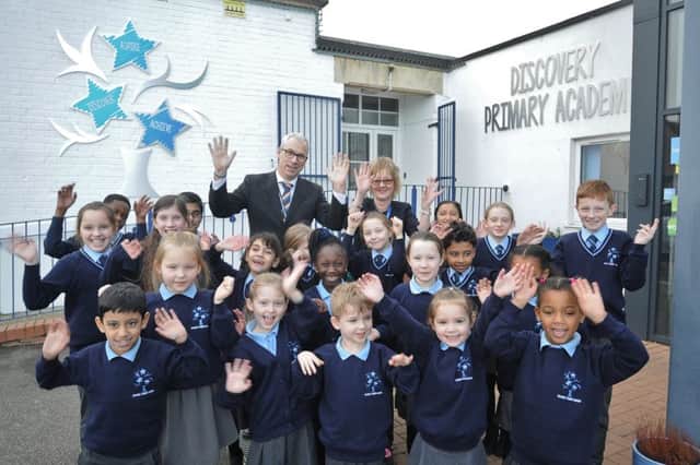 Michelle Siequien and Mike Sandeman with pupils at Discovery Primary Academy celebrating their new status EMN-190122-150518009