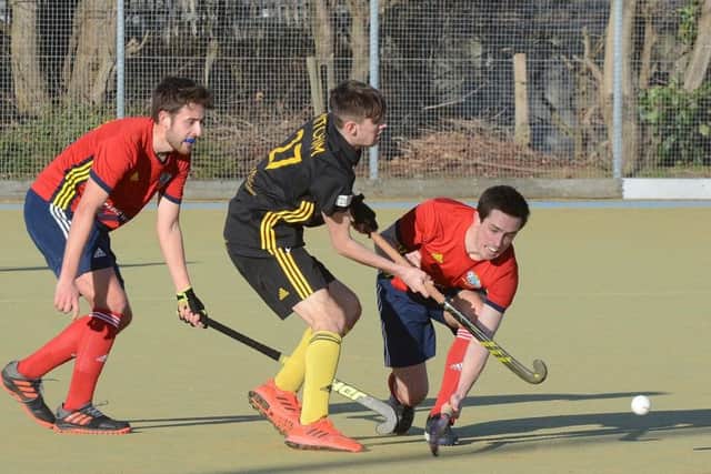 City of Peterborough (red) in action against Beeston. Photo: David Lowndes.