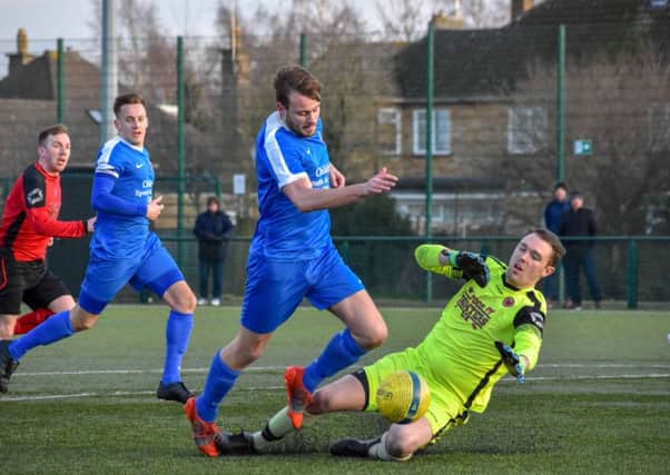 Action from Netherton's 2-2 draw with Whittlesey Athletic (blue) last weekend. Photo: James Richardson.
