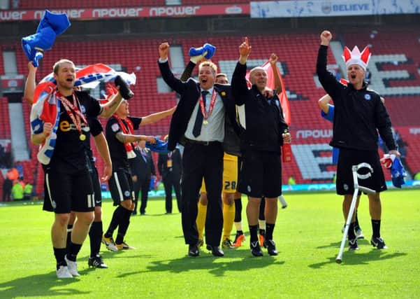 Grant McCann (left) and Darren Ferguson (centre) celebrate their League One play-off final triumph with Posh at Old Trafford in 2011.