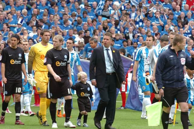 Gramt McCann and Darren Ferguson lead Posh out for the League One play-off final against Huddersfield at Old Trafford in May, 2011.