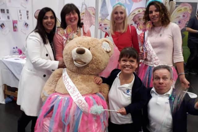 The Annas Hope stand with guest TV chef Spice Queen Parveen Ashraf,  charity organiser Carole Hughes,  Denise Curran and Alison Bromwich and film star Warwick Davis and Samantha Davis.