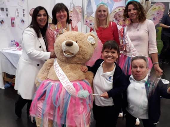 The Annas Hope stand with guest TV chef Spice Queen Parveen Ashraf,  charity organiser Carole Hughes,  Denise Curran and Alison Bromwich and film star Warwick Davis and Samantha Davis.