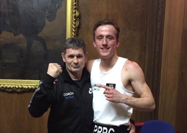 Peterborough Police boxer Ryan Davies  pictured with club coach Paul Goode.