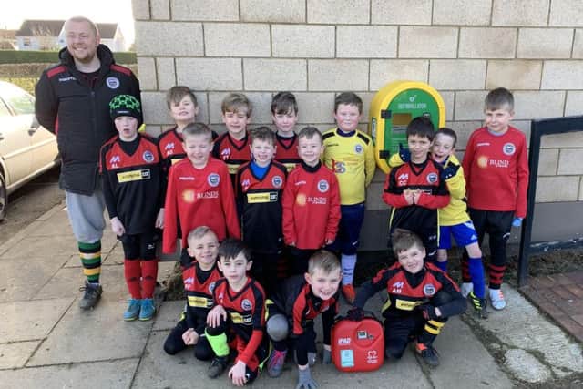 Langtoft United Under 8 Coach, James Price with the players.