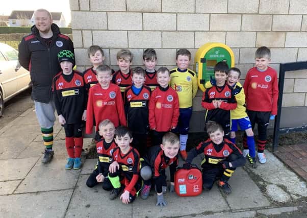Langtoft United Under 8 Coach, James Price with the players.