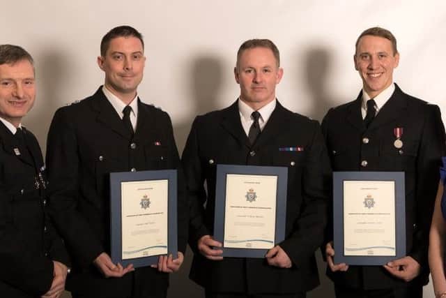 PC Andrew Atkins, PC William Murphy and T/Insp Nick Waters receive their awards