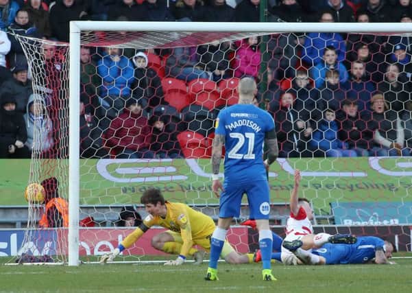 Conor O'Malley of Peterborough United can't prevent Doncaster Rovers from equalising with a Ben White own goal. Photo: Joe Dent/theposh.com