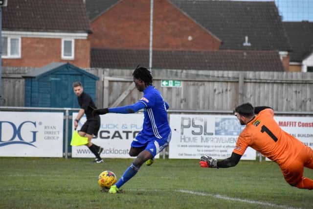 Abduramane Sanyo Sali scores for Peterborough Sports against Aylesbury. Photo: James Richardson.