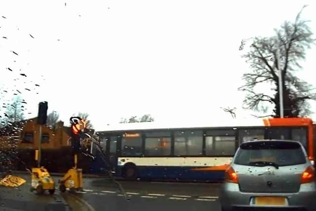 The bus going through the red light. Photo: Richard Farr