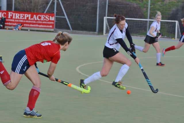 City of Peterborough Ladies (red) y action at Bretton Gate v Wapping. Photo: David Lowndes.
