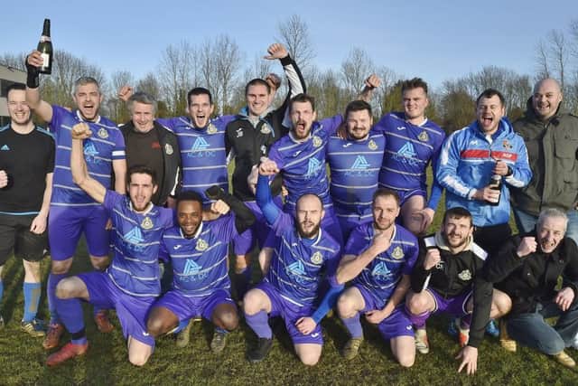 Peterborough NECI celebrate their Peterborough Division Three title success. Photo: David Lowndes.