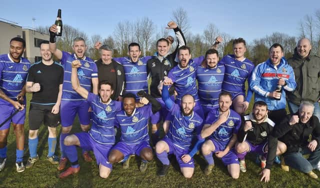 Peterborough NECI celebrate their Peterborough Division Three title success. Photo: David Lowndes.