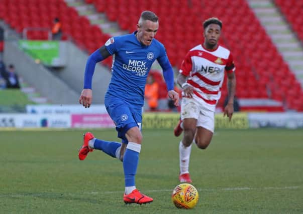 Joe Ward in action for Posh at Doncaster.