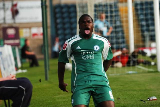 Posh legend Aaron Mclean celebrates a goal.