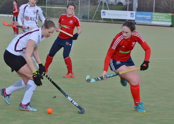 City of Peterborougth Ladies (red) in action against Wapping last weekend. Photo: David Lowndes.