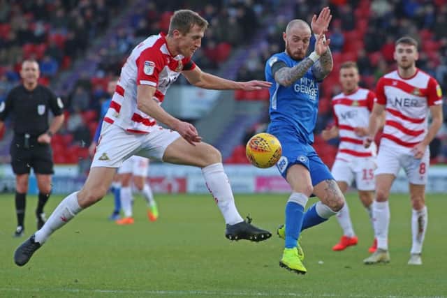 Marcus Maddison in action for Posh at Doncaster. Photo: Joe Dent/theposh.com.