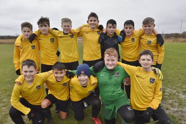 Pictured are Glinton & Northborough Navy Under 13s before their 5-0 defeat by Park Farm Pumas Red. They are from the left, back, Jack Brearley, Luke Broadway, Callum Jesson, Jack Ray, Jamie Parker, Jacob Horner, Reuben Hinch,  front, Finn Macaulay, Alex Smith, Harry Page, Charlie Rigby and Elliot Gee.