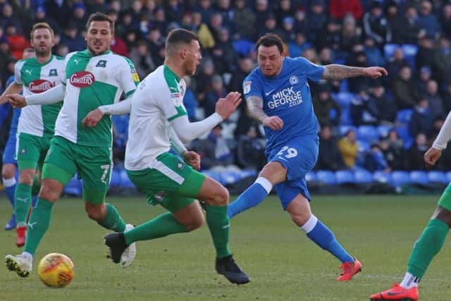 Lee Tomlin should return for Posh at Oxford.